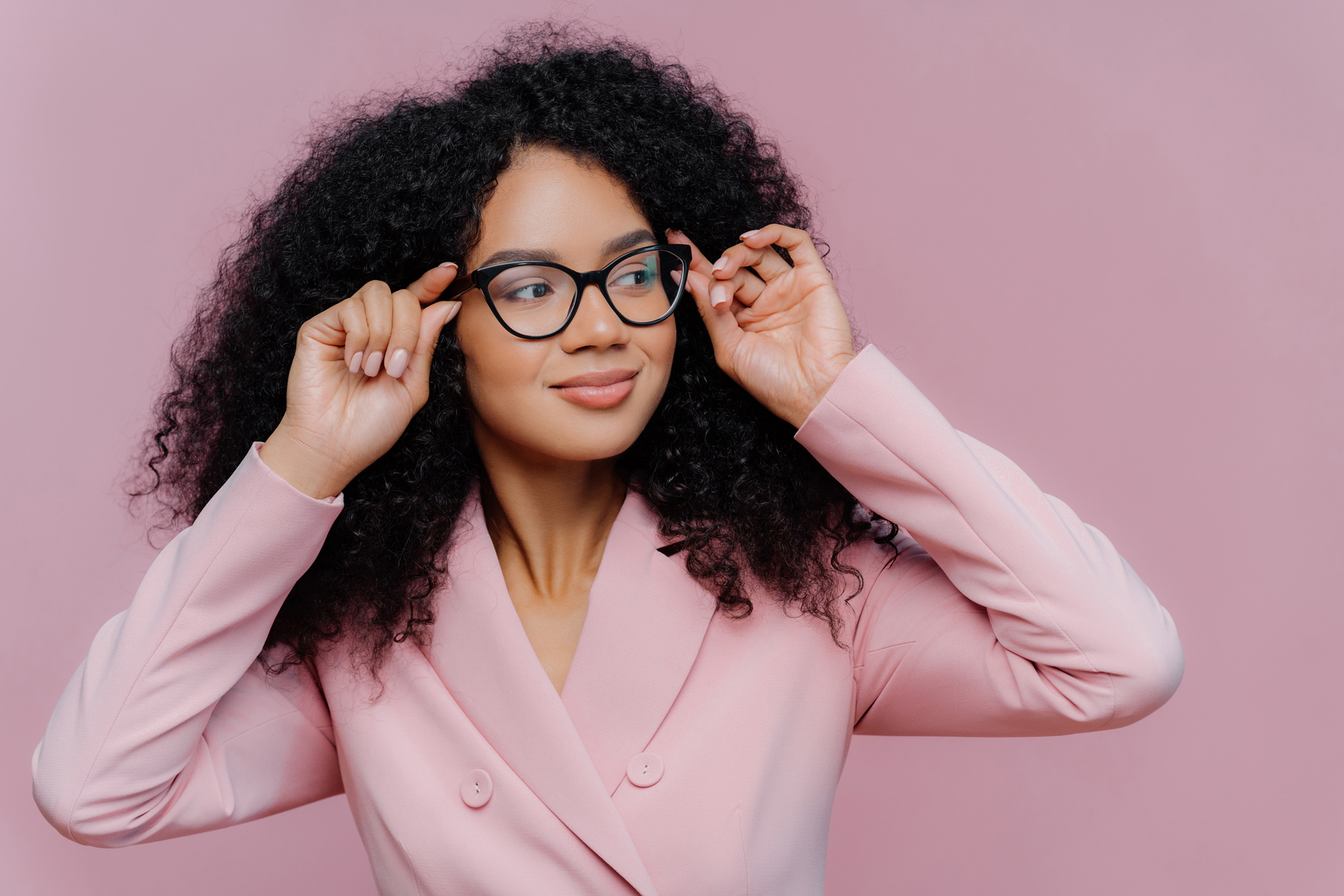 Woman Wearing Pink Blazer Holding Eyeglasses Studio Portrait